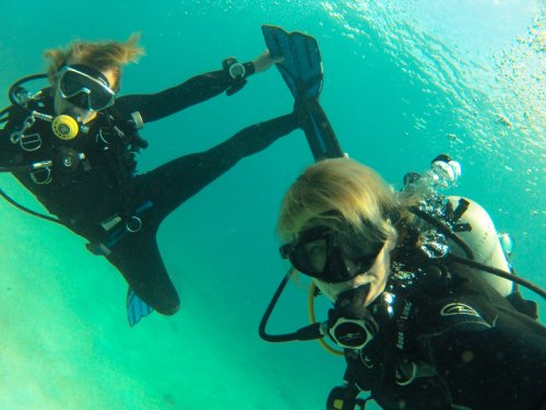 Oscar and Megan underwater being silly