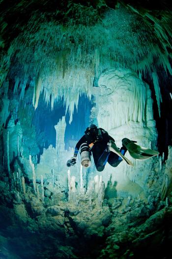 A diver float through amazing crystal formations in Fangorn Forest, Dan's Cave, Abaco Island. Photo by Brian Kakuk