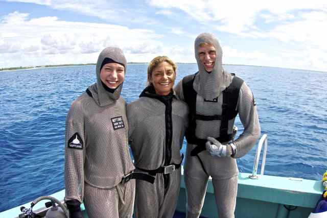 Preparing to go on our first shark dive in full chain mail gear. 